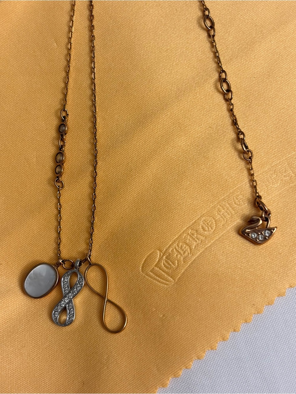 Swarovski Gold-Tone Infinity & Crystal Pendant Necklace with Mother-of-Pearl
